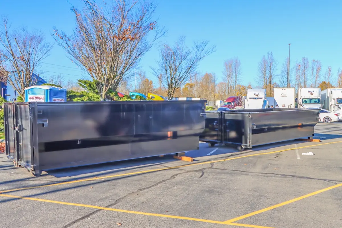 Professional dumpster rental service with roll-off container on residential driveway in Larkspur